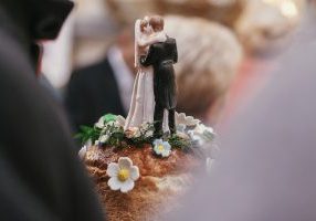 wedding cake topper of groom and bride